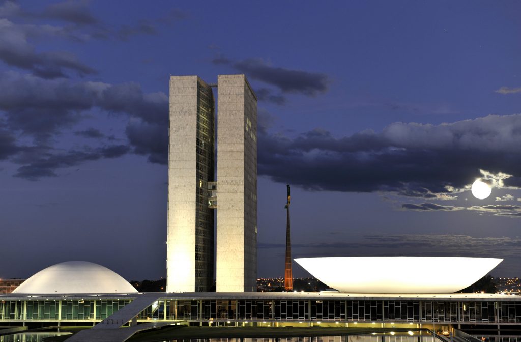 night time photo of the two buildings that comprise Brazil's chambers of congress.